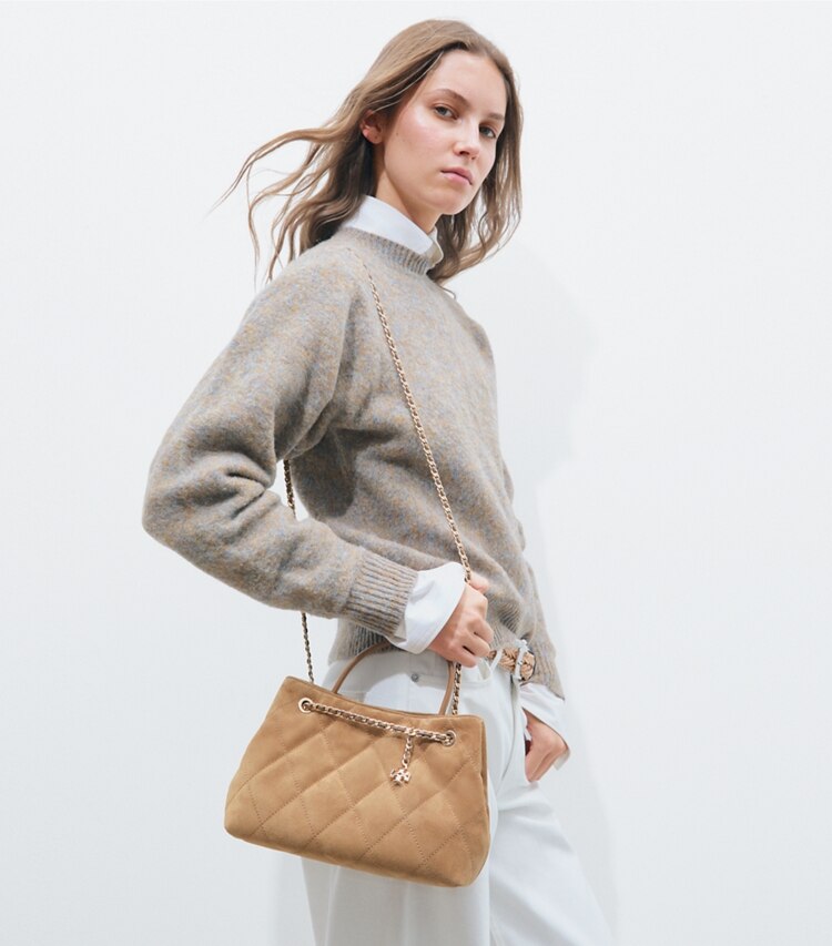 Tory Burch designer crossbody bags Small Fleming Suede Carryall in Toffee accessory on model