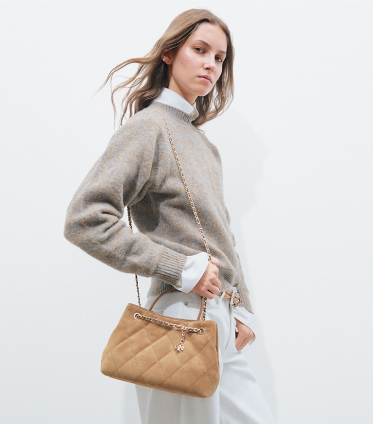 Tory Burch designer crossbody bags Small Fleming Suede Carryall in Toffee accessory on model