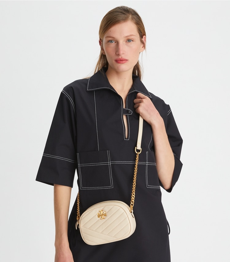 Tory Burch designer crossbody bags Small Kira Chevron Camera Bag in New Cream accessory on model