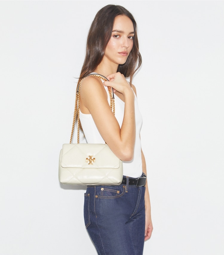 Tory Burch designer shoulder bags Small Kira Diamond Quilt Convertible Shoulder Bag in Warm White accessory on model