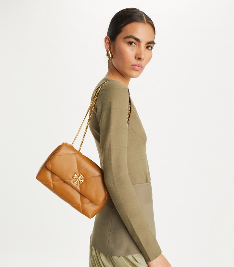 Tory Burch designer shoulder bags Small Kira Diamond Quilt Convertible Shoulder Bag in Tan accessory on model
