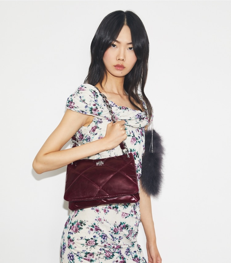 Tory Burch designer shoulder bags Small Kira Diamond Quilt Distressed Shoulder Bag in Dark Carmine accessory on model