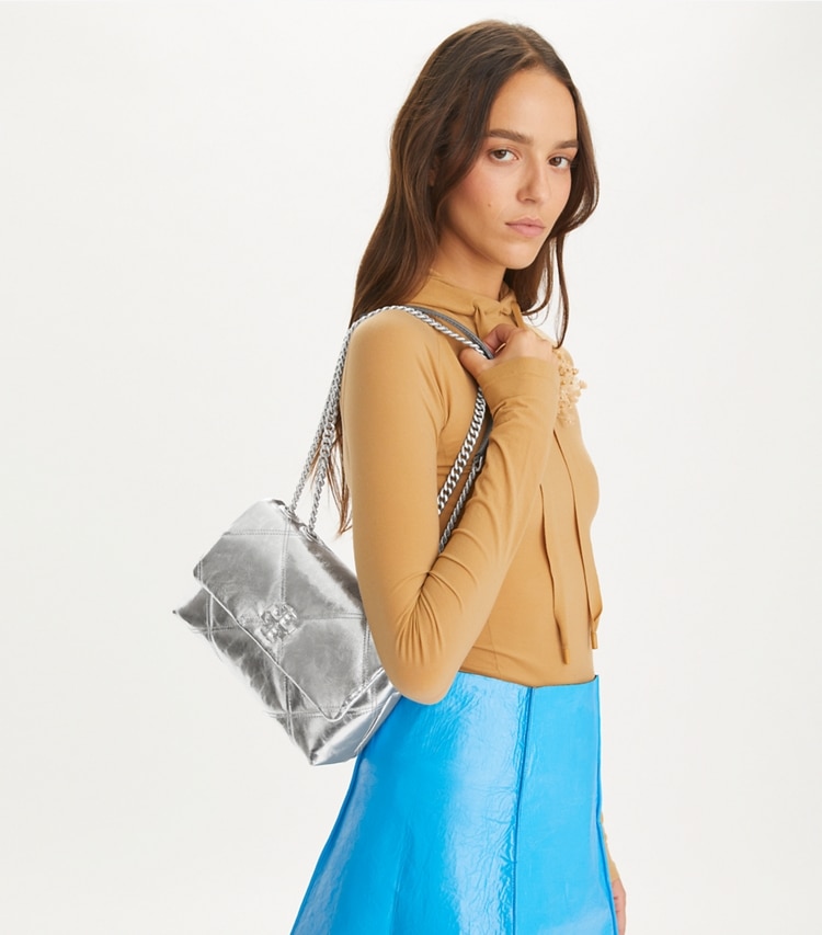 Tory Burch designer shoulder bags Small Kira Diamond Quilt Metallic Convertible Shoulder Bag in Silver accessory on model