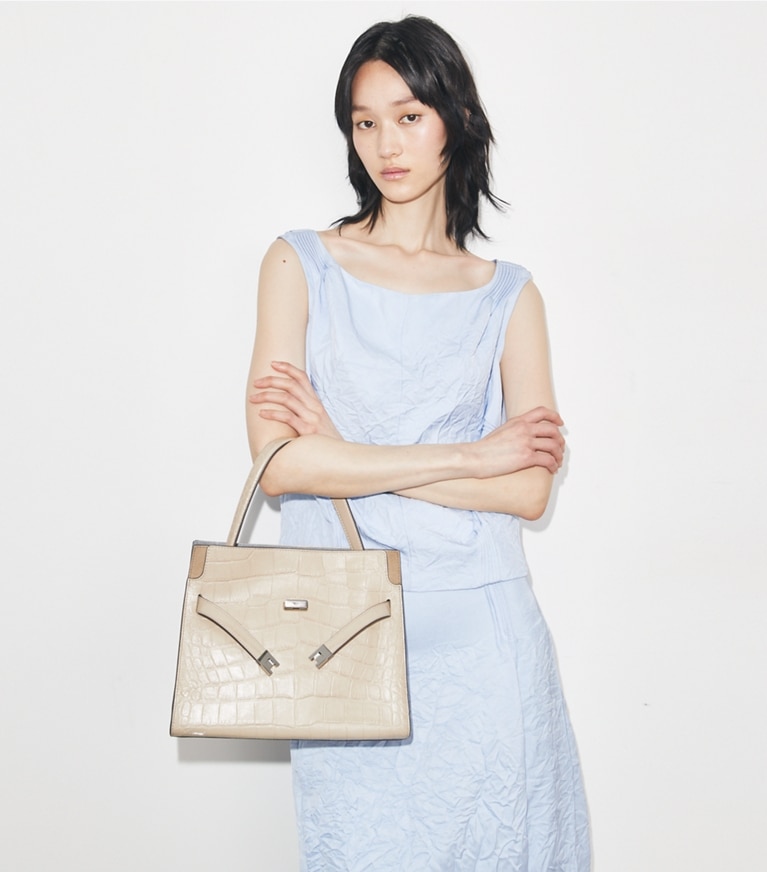Tory Burch designer satchels Small Lee Radziwill Embossed Double Bag in Light Hickory accessory on model