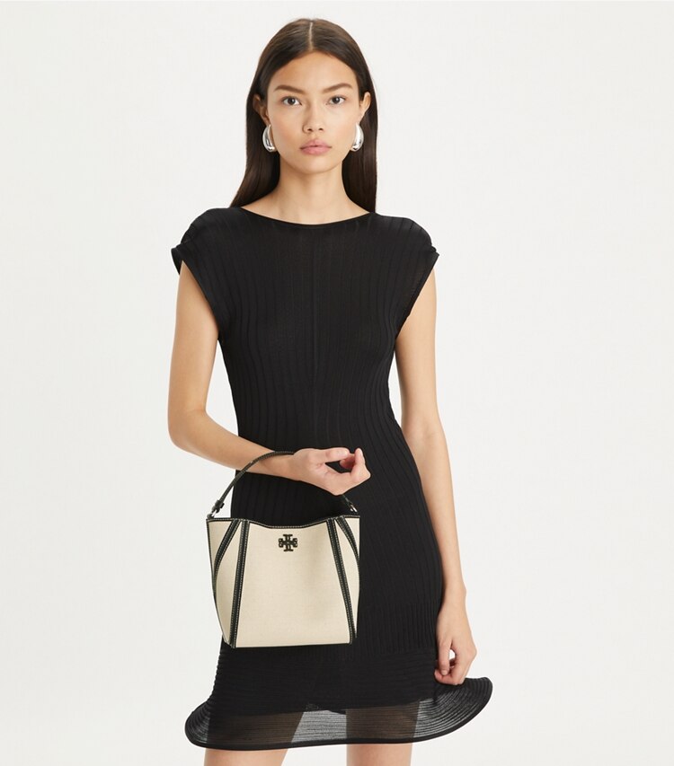 Tory Burch designer crossbody bags Small McGraw Canvas Bucket Bag in Natural Mutli accessory on model