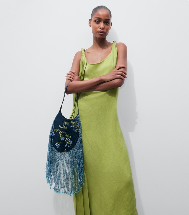 Tory Burch designer shoulder bags Small Pierced Embellished Bag in Blue Multi additional on model