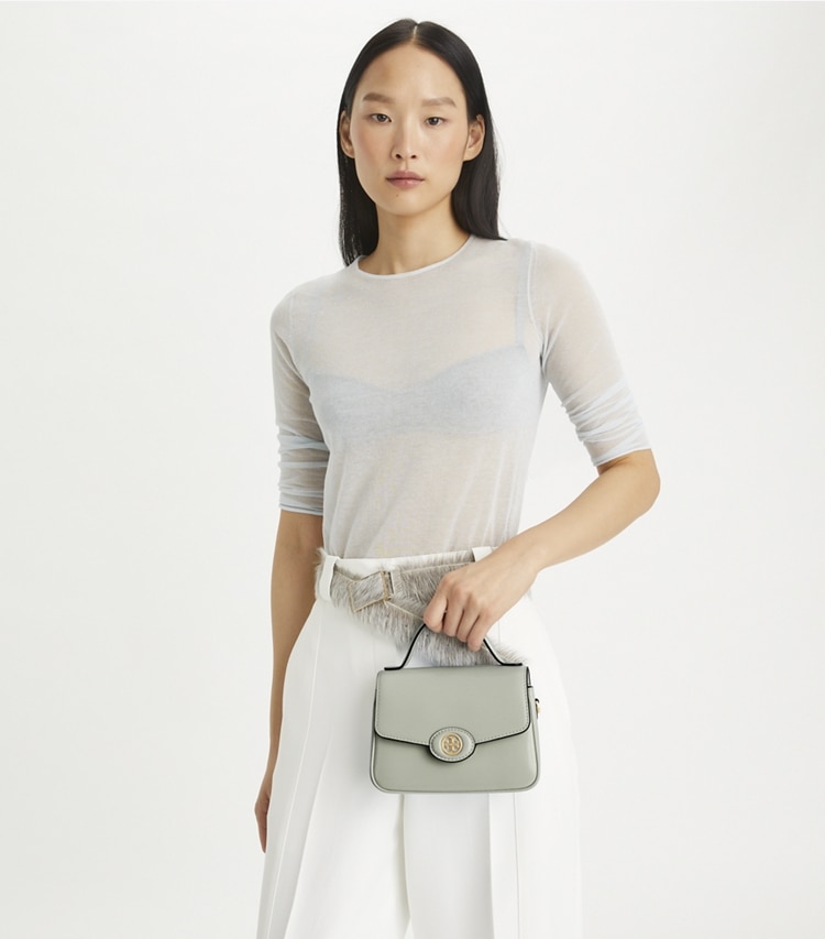 Tory Burch designer crossbody bags Small Robinson Spazzolato Top-Handle Bag in Light Granite additional on model