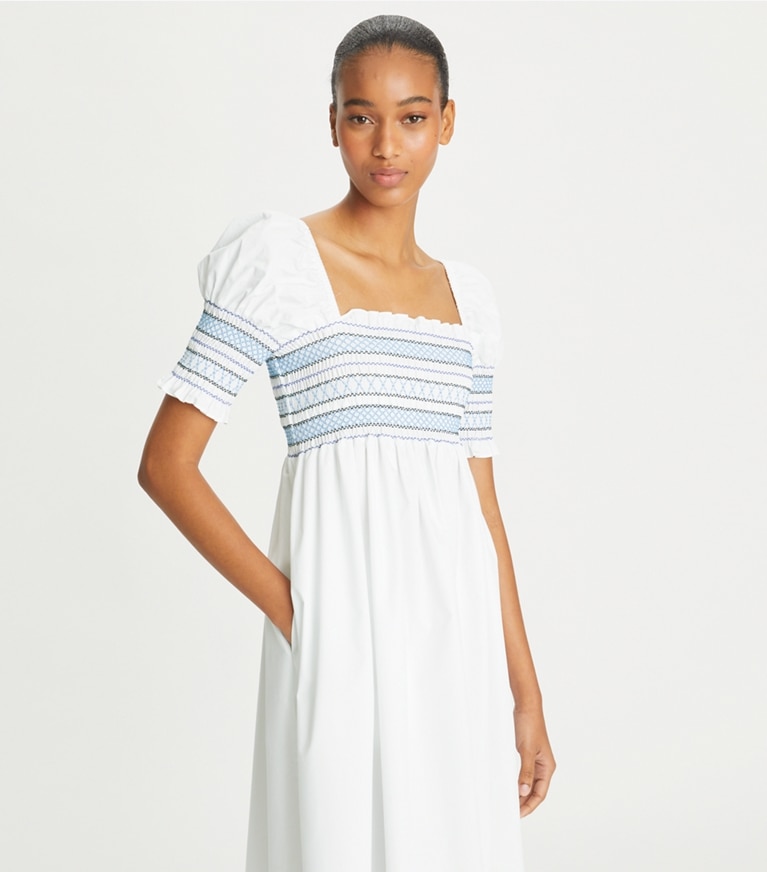 https://s7.toryburch.com/is/image/ToryBurch/style/smocked-cotton-midi-dress-on-model-detail.TB_151765_100_20230509_OMDET.pdp-767x872.jpg