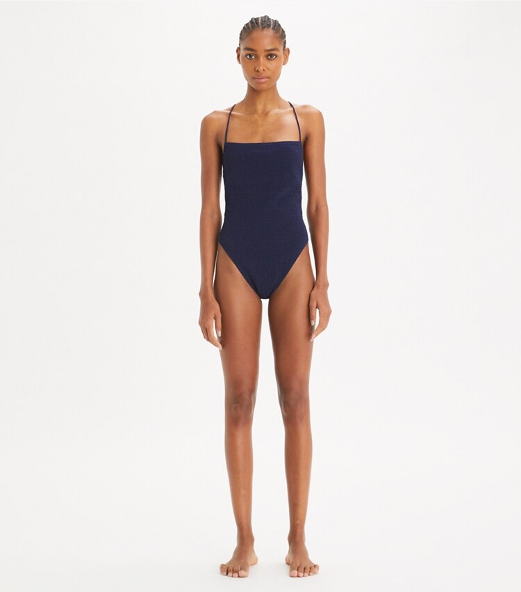 Tory Burch designer one pieces Smocked Swimsuit in Medium Navy on model front