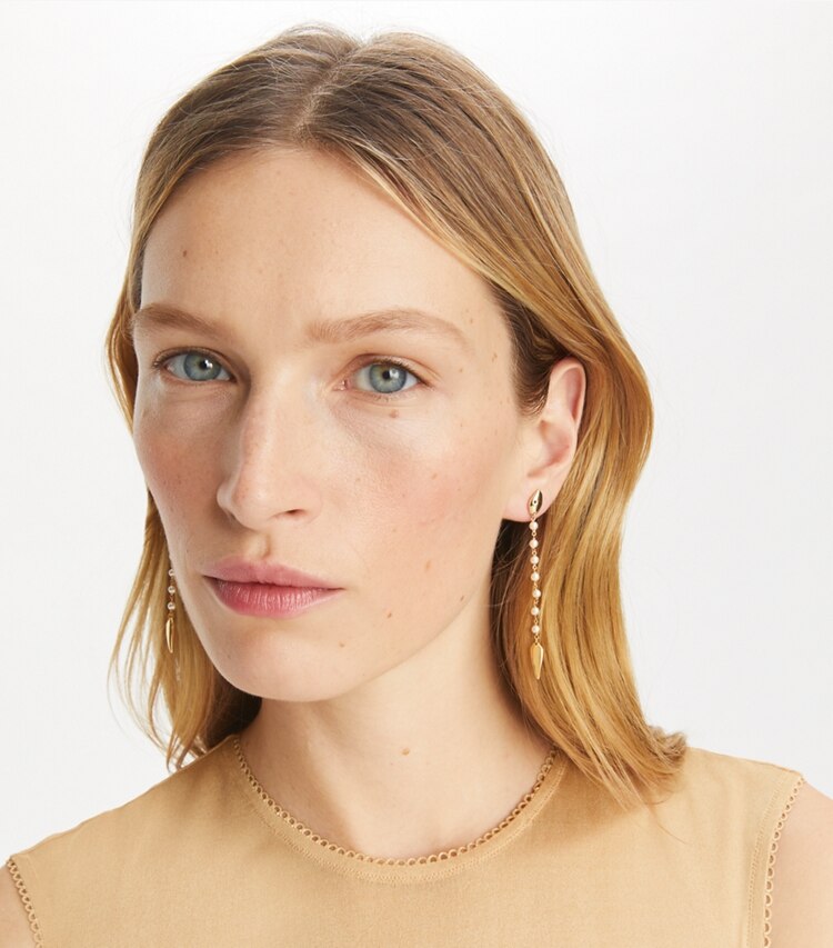 Tory Burch designer earrings Snake Linear Earring in Tory Gold / Pearl accessory on model