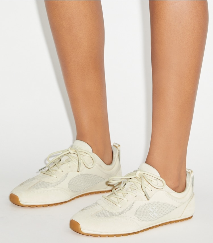 Tory Burch designer sneakers Sneaker Field in LIGHT CREAM accessory on model