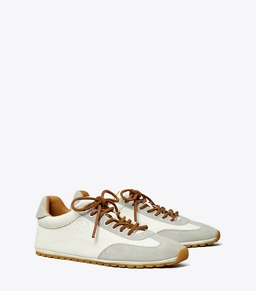 Tory Burch designer sneakers Sneaker Field in BLANC / LOUTRE GRAY angle