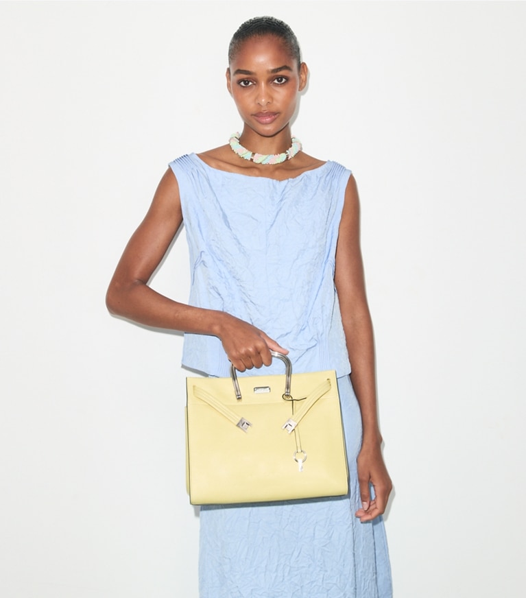 Tory Burch designer tote bags Soft Lee Radziwill Bag in Soft Yellow accessory on model