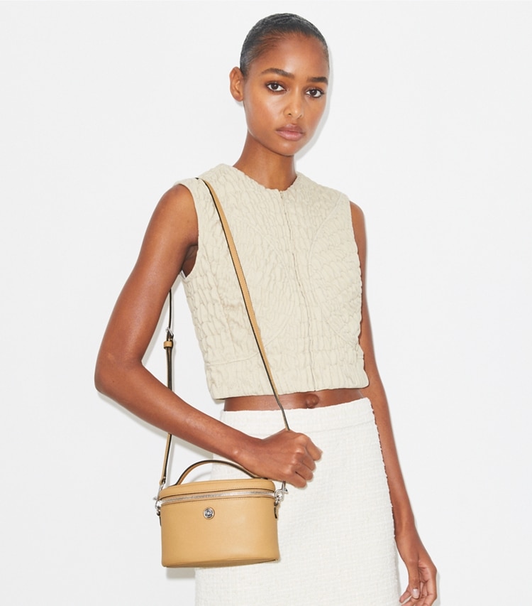 Tory Burch designer mini bags Soft Pebbled Vanity Case in Biscotti accessory on model