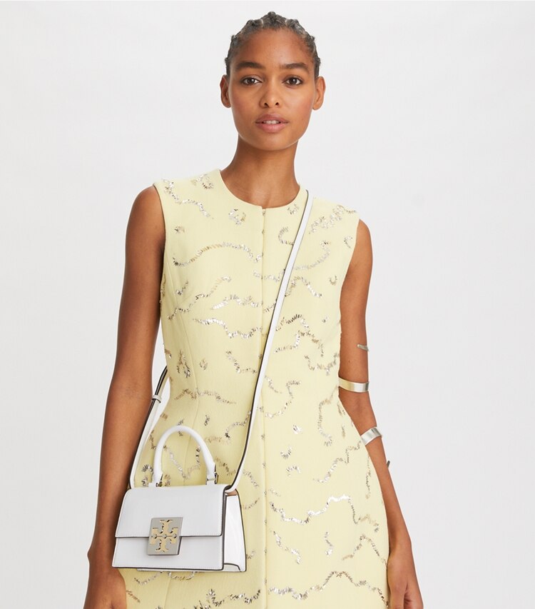Tory Burch designer crossbody bags Spazzolato Mini Top-Handle Bag in Optic White accessory on model