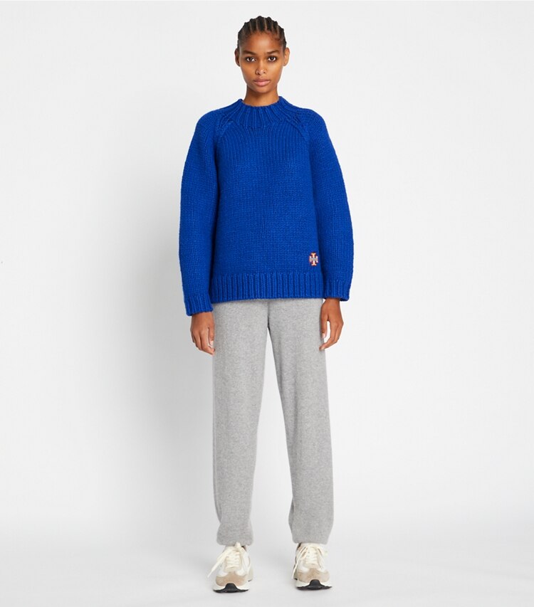 Tory Sport designer sweaters Speckled Hand Knit Mockneck Sweater in Slalom Blue on model front