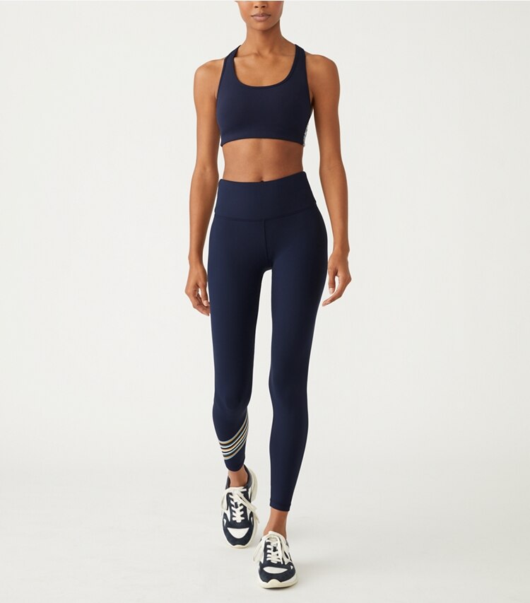 Tory Sport designer sports bras Spectrum Side-Stripe Mesh-Back Bra in Tory Navy / Ridge on model front