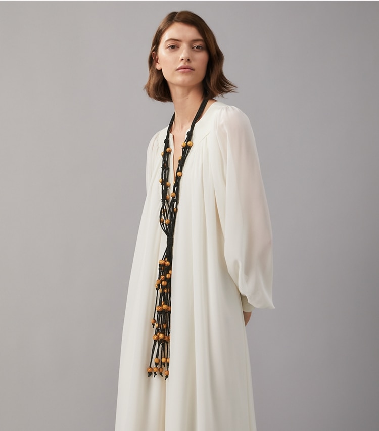 Tory Burch designer necklaces Statement Macrame Necklace in Rolled Brass / Black accessory on model