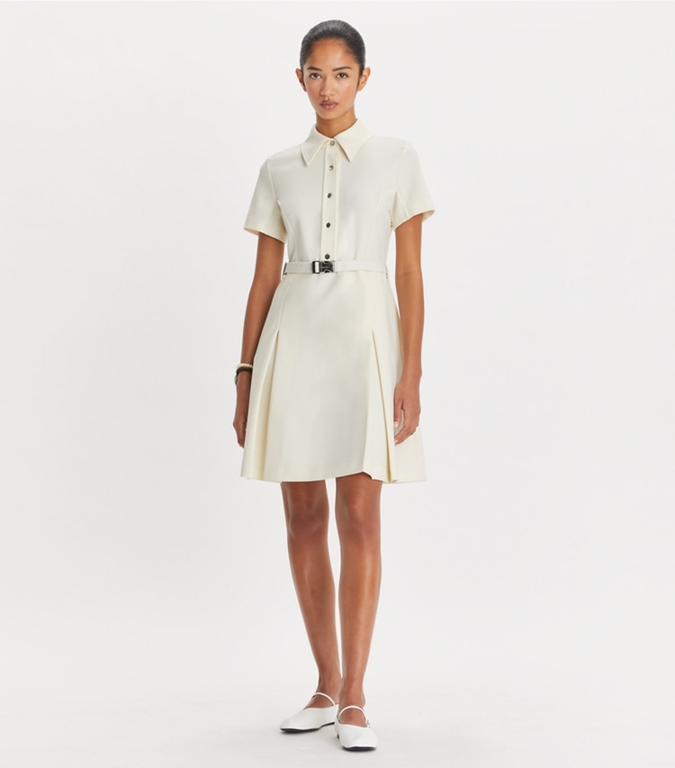Tory Sport designer dresses Stretch Golf Dress in NEW IVORY on model front