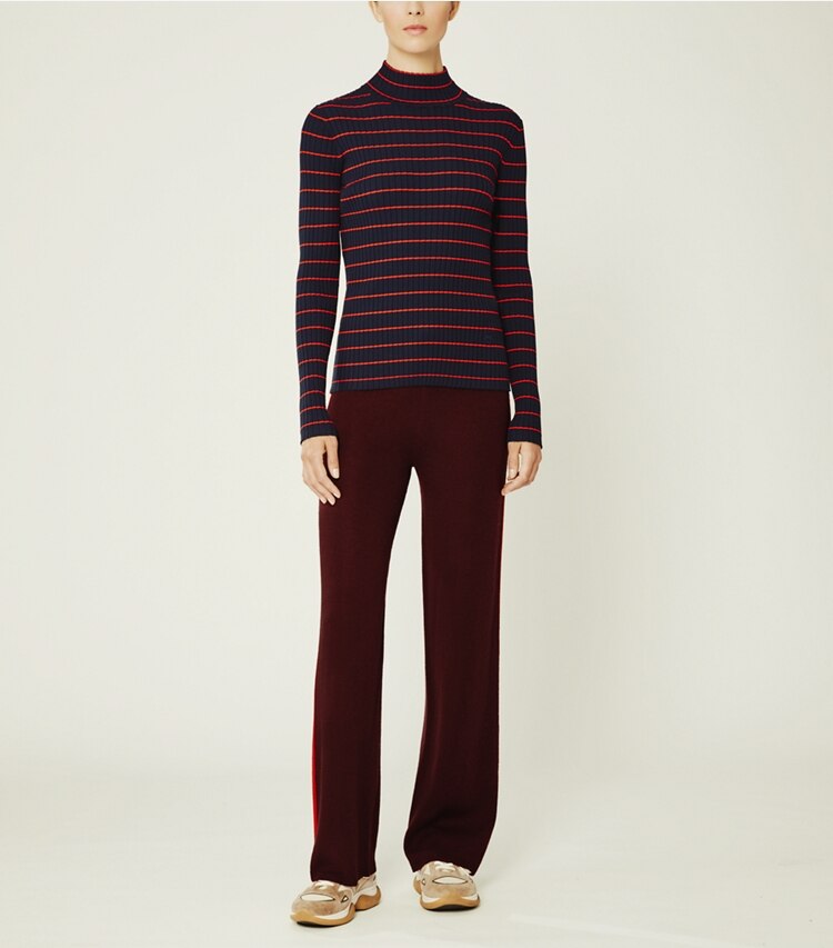 Tory Sport designer sweaters Striped Ribbed Soft Tech Knit Turtleneck in Tory Navy Open Stripe on model front