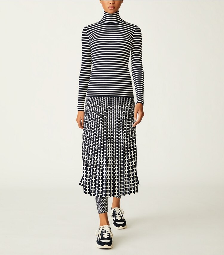Tory Sport designer sweaters Striped Ribbed Tech Knit Turtleneck in Tory Navy / Ivory Pearl on model front