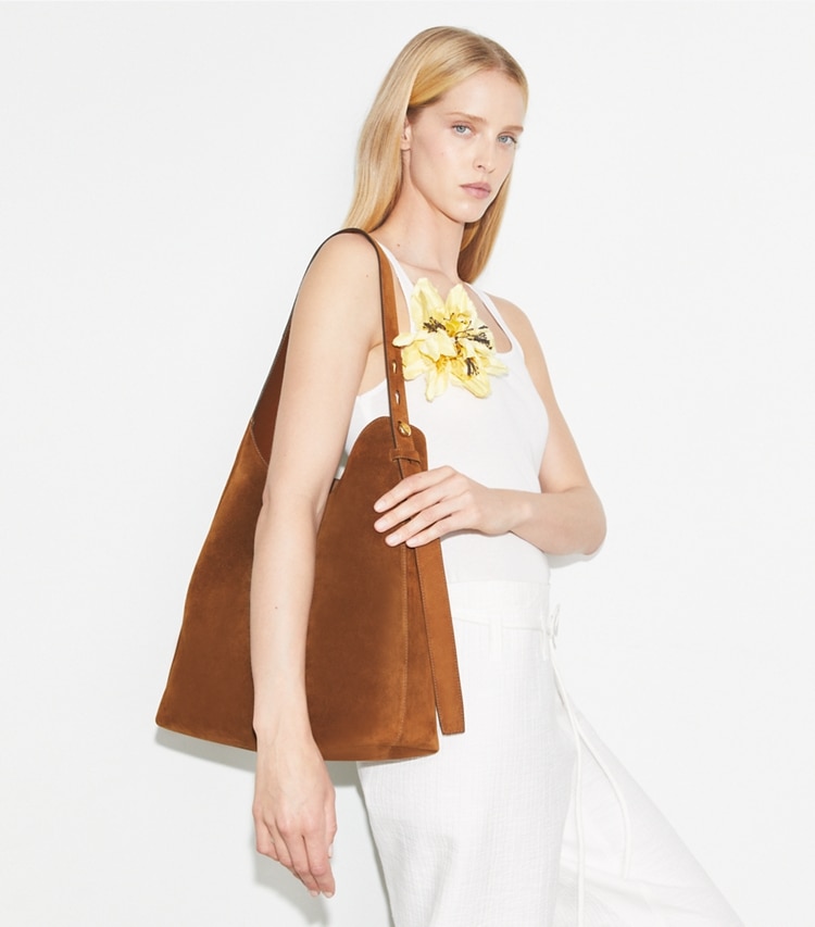 Tory Burch designer hobo bags Suede Hobo Bag in Caramel accessory on model