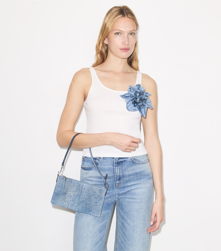 Tory Burch designer shoulder bags Suede Print Denim Pochette in Blue Jean accessory on model