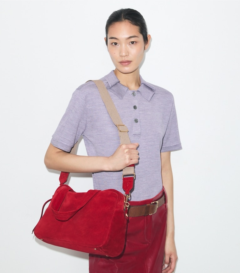 Tory Burch designer satchels Suede Satchel in Toucan Red accessory on model