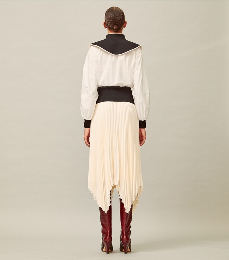 Tory Burch designer bottoms Sunburst Pleated Skirt in New Ivory on model back