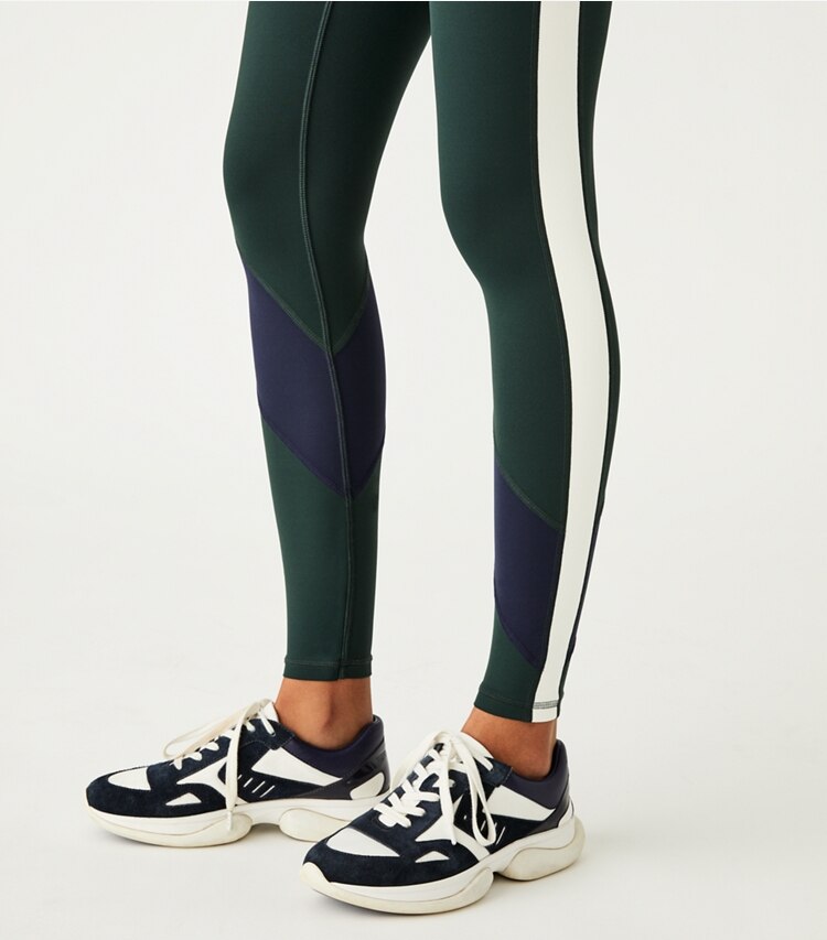 Tory Sport designer bottoms Super High-Rise Weightless Color-Block Legging in Conifer / Tory Navy on model detail