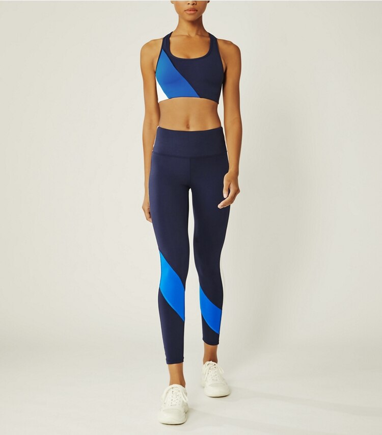 Tory Sport designer bottoms Super High-Rise Weightless Color-Block Legging in Tory Navy/Surf Blue on model front
