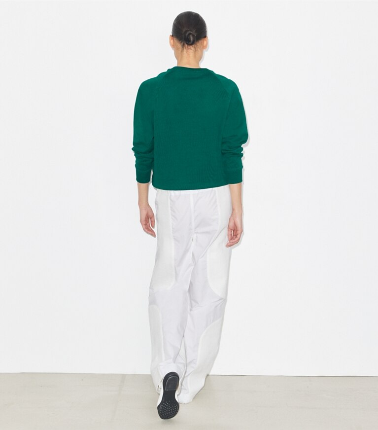 Tory Burch designer sweaters Sweat-shirt logo à col rond et manches raglan en molleton et mérinos in Emerald front
