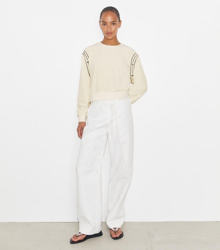 Tory Burch designer sweaters T Logo Velour Crewneck in New Ivory on model front