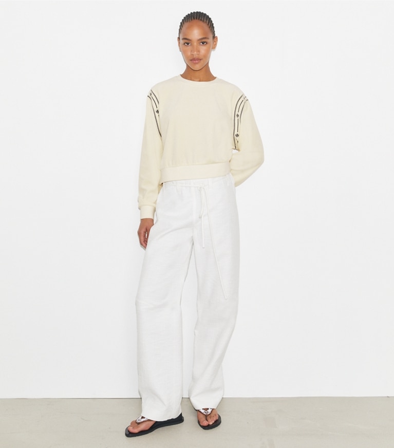 Tory Burch designer sweaters T Logo Velour Crewneck in New Ivory on model front