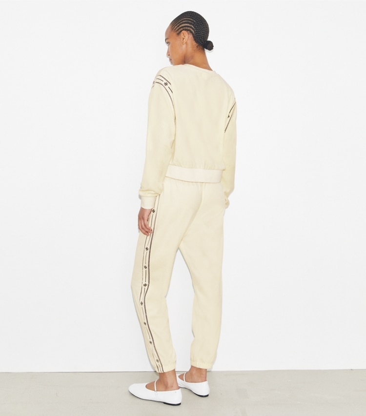 Tory Burch designer bottoms T Logo Velour Jogger in New Ivory on model back