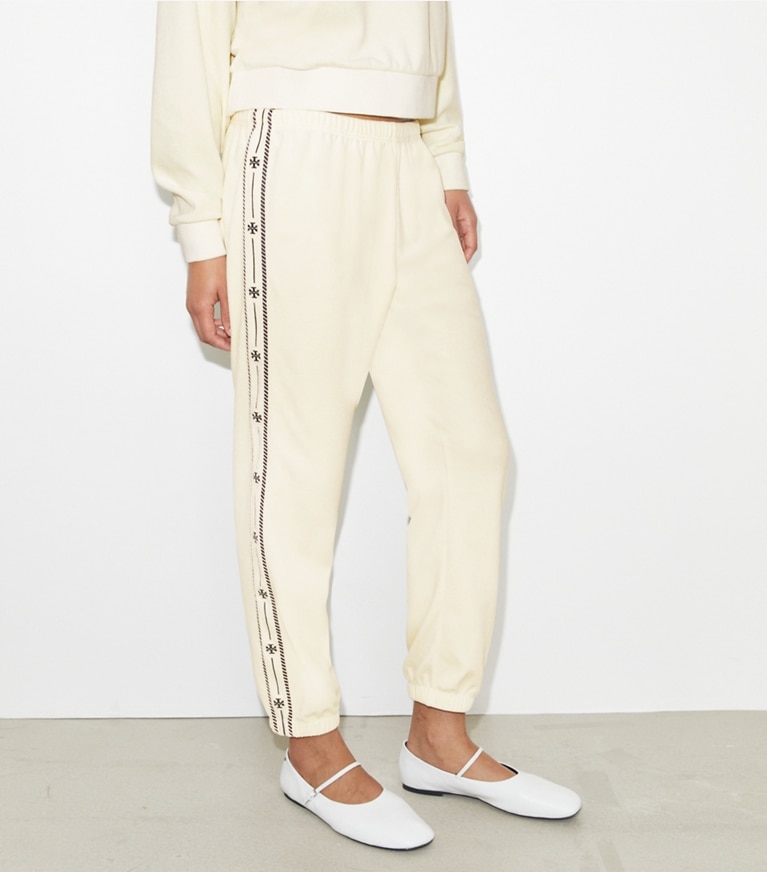 Tory Burch designer bottoms T Logo Velour Jogger in New Ivory on model detail