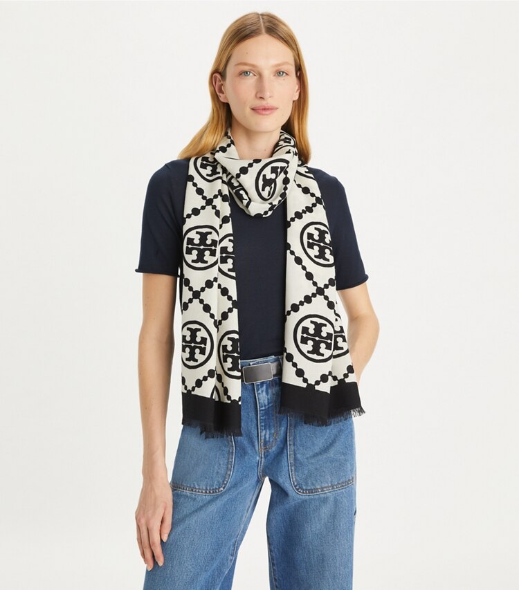 Tory Burch designer scarves T Monogram Bordered Oblong Scarf in T Monogram Bordered Oblong - Black accessory on model