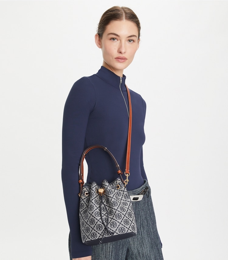 Tory Burch designer crossbody bags T Monogram Bucket Bag in Tory Navy accessory on model