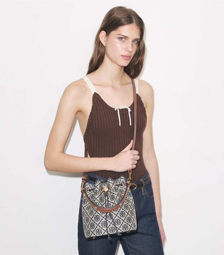 Tory Burch designer crossbody bags T Monogram Bucket Bag in Tory Navy accessory on model