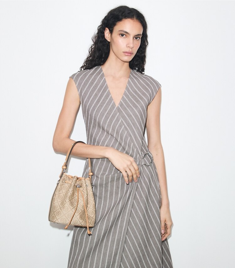 Tory Burch designer crossbody bags T Monogram Bucket Bag in Flax accessory on model