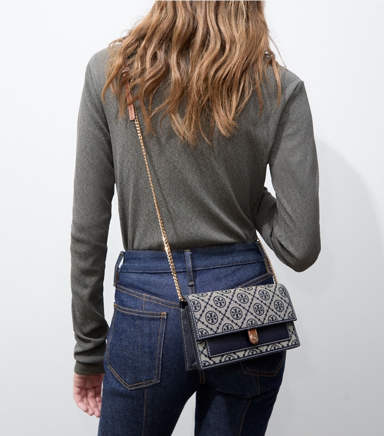 Tory Burch designer crossbody bags T Monogram Chain Wallet in TORY NAVY accessory on model