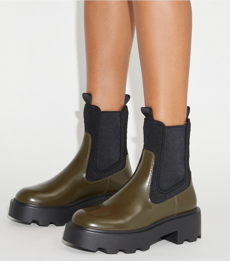 Tory Burch designer ankle boots T Monogram Chelsea Lug Boot in DARK OLIVE accessory on model