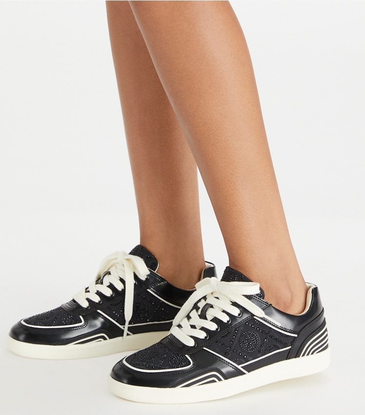 Tory Burch designer sneakers T Monogram Clover Court Sneaker in BLACK T MONOGRAM CRYSTAL / PERFECT BLACK accessory on model