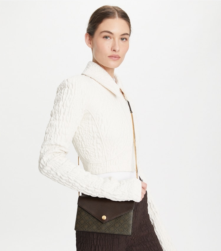 Tory Burch designer mini bags T Monogram Coated Canvas Envelope Crossbody in French Press accessory on model