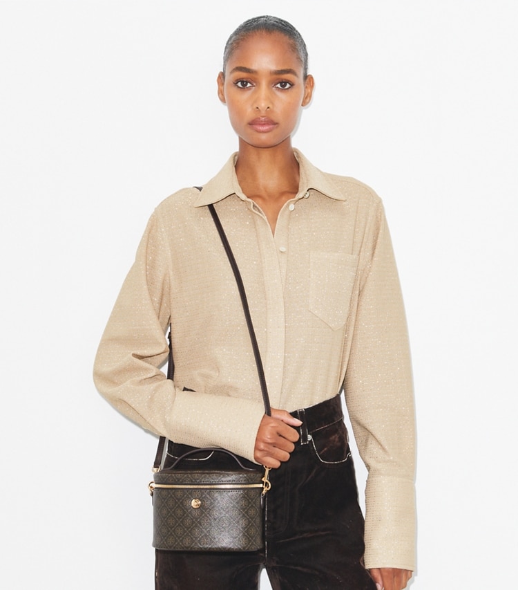 Tory Burch designer mini bags T Monogram Coated Canvas Soft Vanity Case in French Press accessory on model