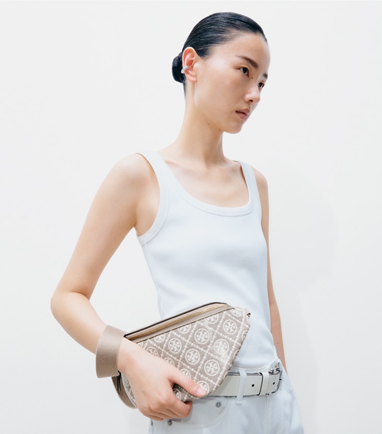 Tory Burch designer belt bags T Monogram Coated Jacquard Belt Bag in Charcoal accessory on model