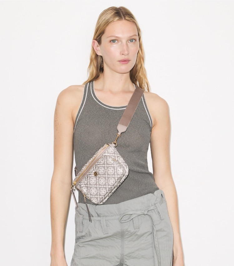 Tory Burch designer belt bags T Monogram Coated Jacquard Mini Belt Bag in Charcoal accessory on model