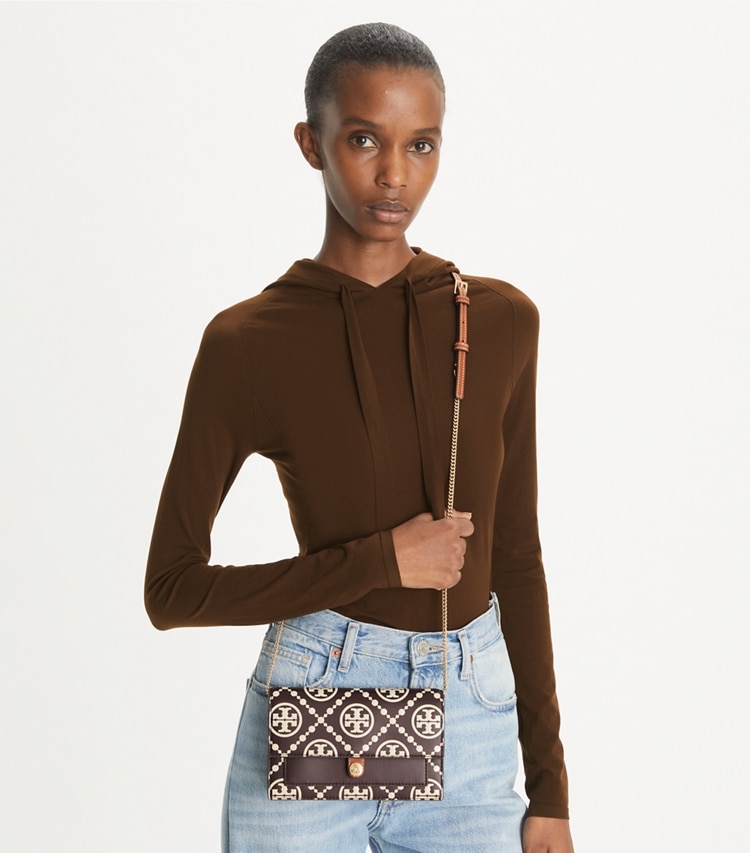 Tory Burch designer mini bags T Monogram Contrast Embossed Crossbody in Deep Maroon / New Cream accessory on model
