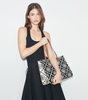 Tory Burch designer tote bags T Monogram Contrast Embossed Tote in Black/White accessory on model