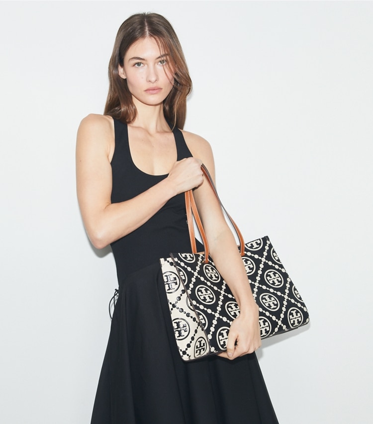 Tory Burch designer tote bags T Monogram Contrast Embossed Tote in Black/White accessory on model